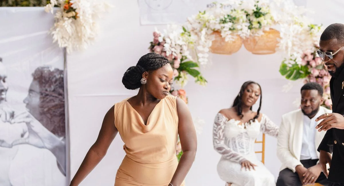 Elegant wedding scene with guests dancing joyfully, highlighting love and celebration.