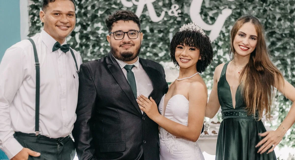 A joyful bride and guests celebrating an elegant wedding indoors.